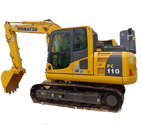 Originele Komatsu PC110 graafmachine met een emmercapaciteit van 0,6 m3 en een bedrijfsgewicht van 11 ton